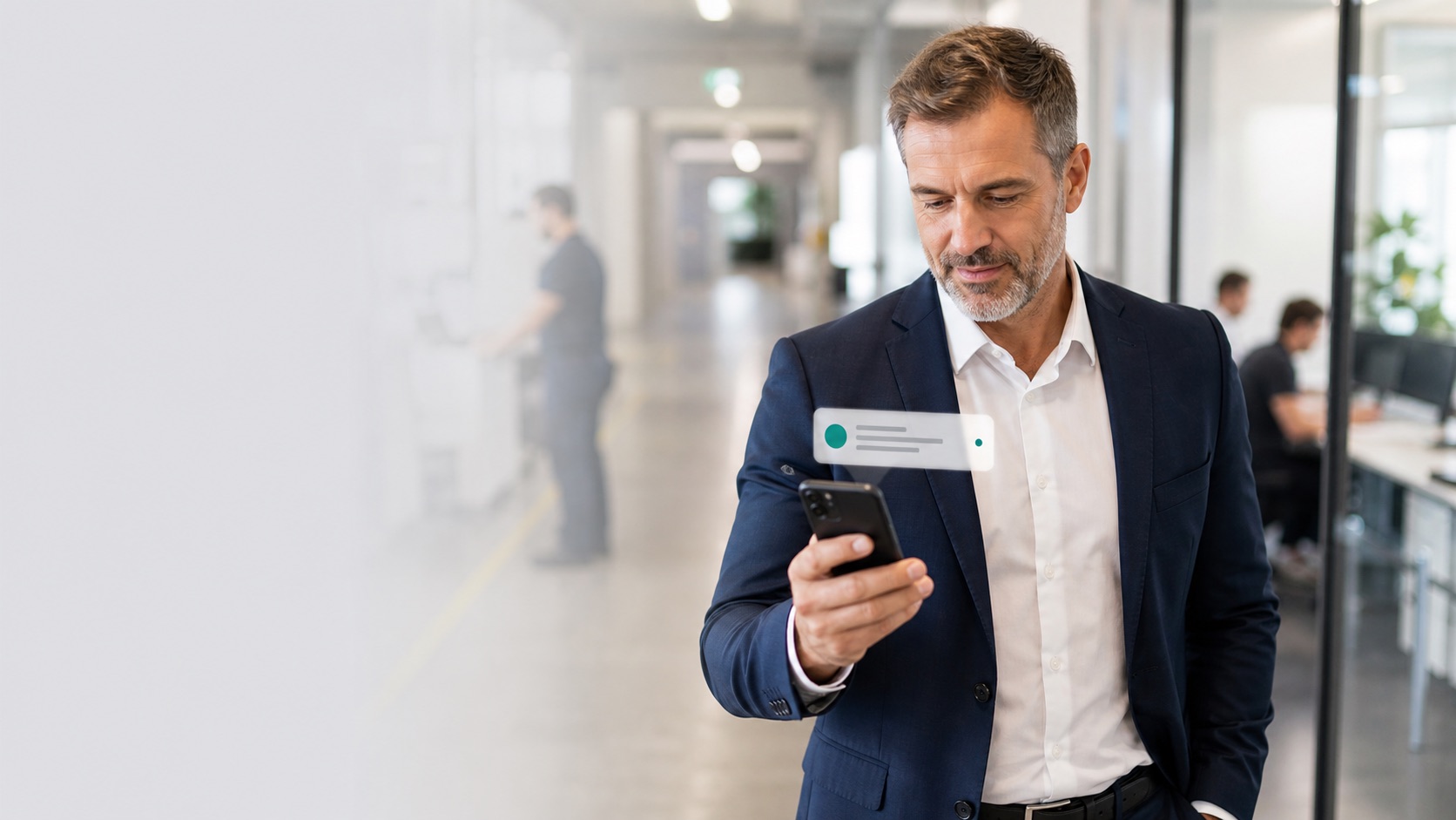 A business leader receiving an important notification on a phone